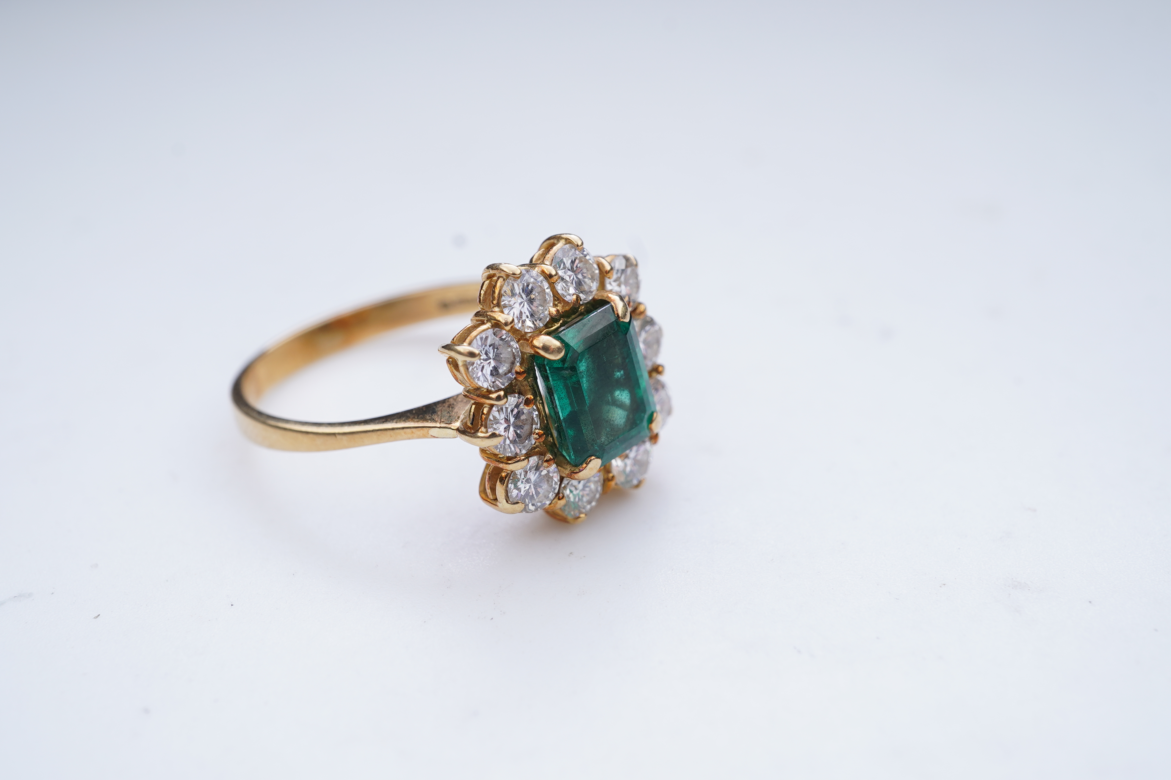 A synthetic emerald and diamond ring